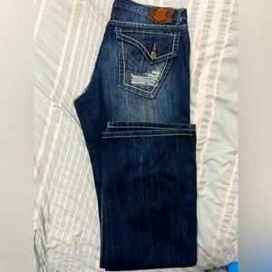 Men’s distressed monarchy jeans